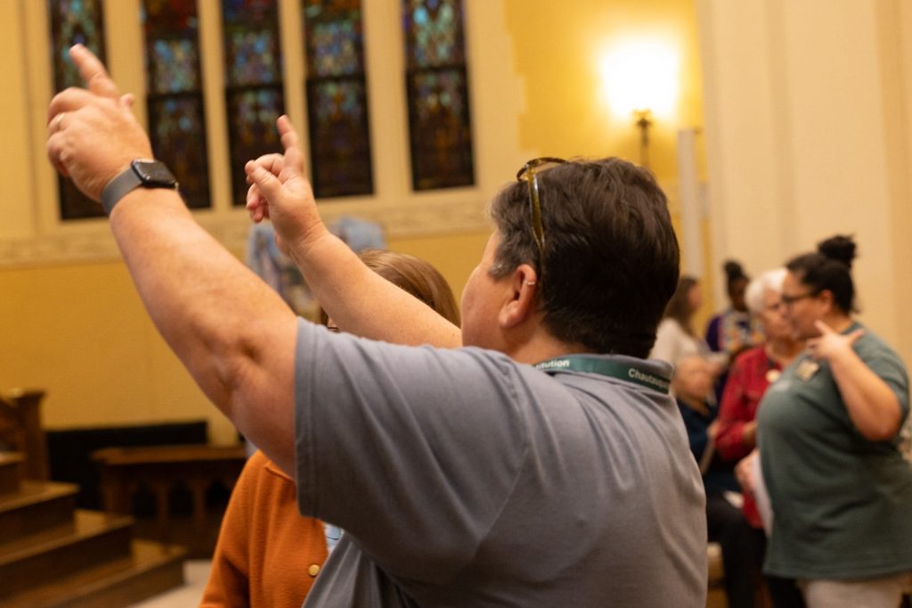 Helen with hands reaching up